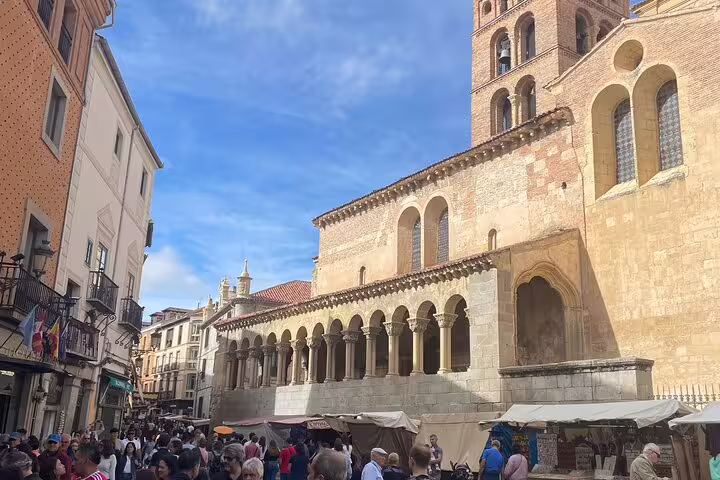 Crowded Plaza Mayor beside Segovia Cathedral on a private Segovia minivan day trip from Madrid, sunny market