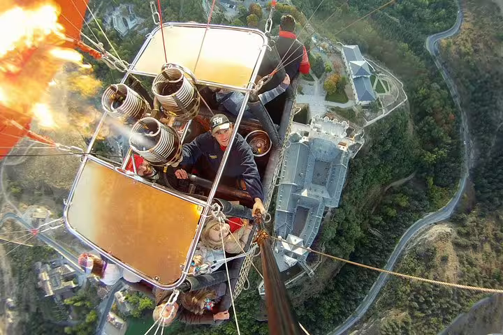 Thrilling hot air balloon adventure over Segovia, capturing stunning views of castles and lush landscapes from above.