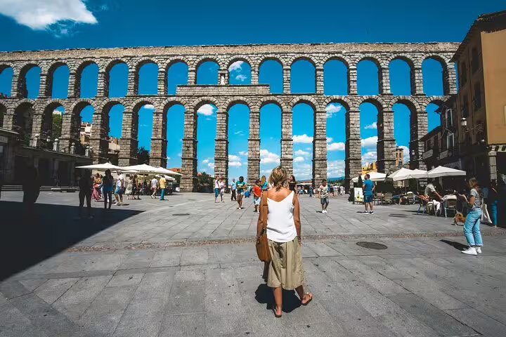 Segovia Roman Aqueduct in Plaza del Azoguejo, highlight of Avila and Segovia private minivan tour from Madrid