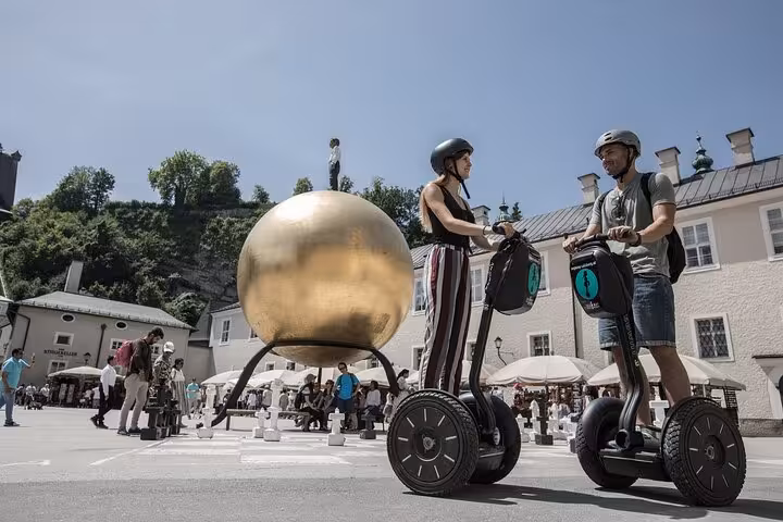 Tourists on Segways exploring Salzburg's modern art and architecture on the City Mountain and Castle Tour.