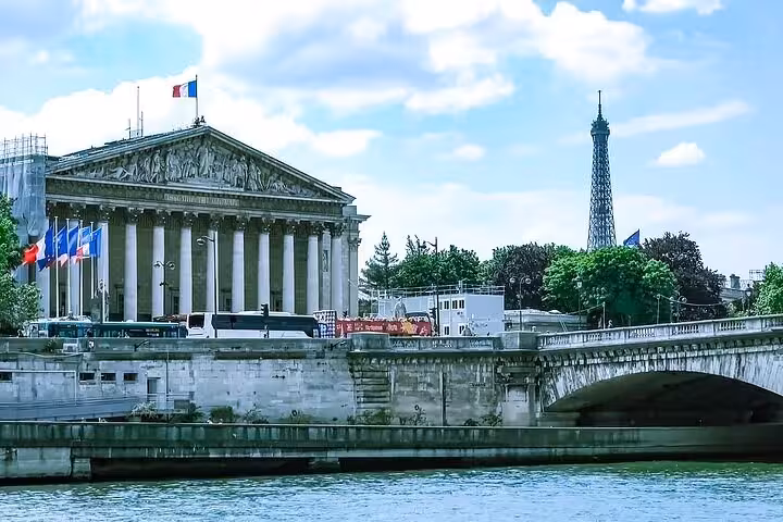 Seine river cruise view of Palais Bourbon with Eiffel Tower in Paris, ideal add-on to Louvre visit