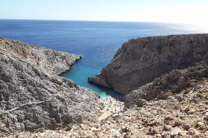 Breathtaking aerial view of Seitan Limania Beach, Crete, featuring dramatic cliffs and crystal-clear turquoise waters.