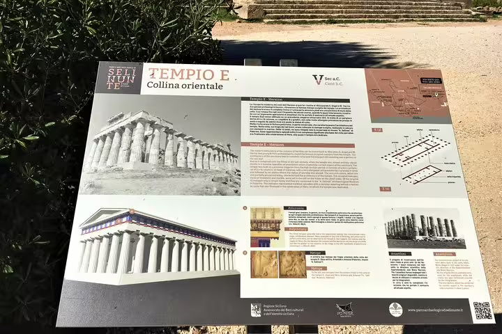 Informative signboard for Tempio E at Selinunte Archaeological Park, explaining the ancient Greek temple ruins on a Palermo day trip