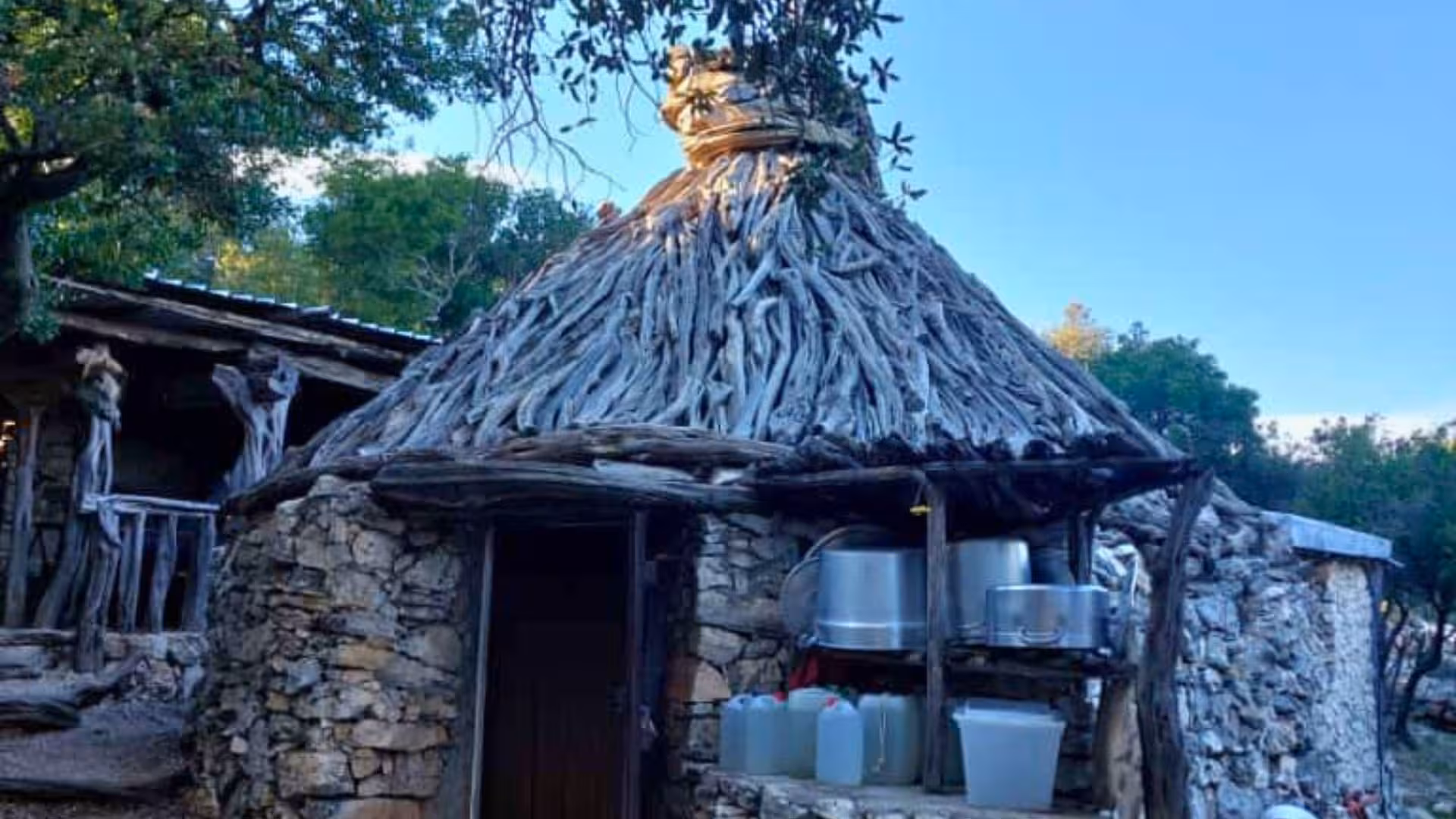 Traditional stone and wood hut along Selvaggio Blu trail, showcasing Sardinia's authentic trekking experience.