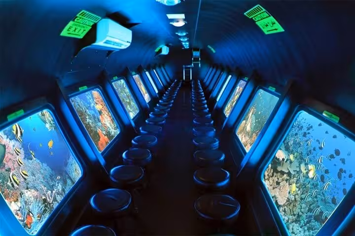 Inside semi submarine cabin with panoramic windows viewing Red Sea coral and fish in Sharm El-Sheikh tour