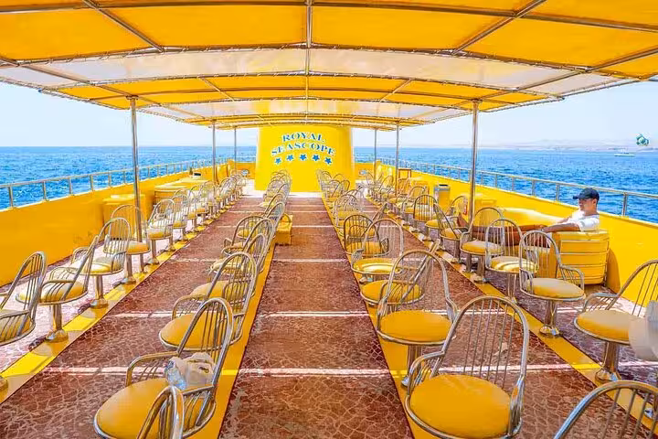 Sunny upper deck seating on semi submarine boat with sea views, Sharm El-Sheikh transfer included