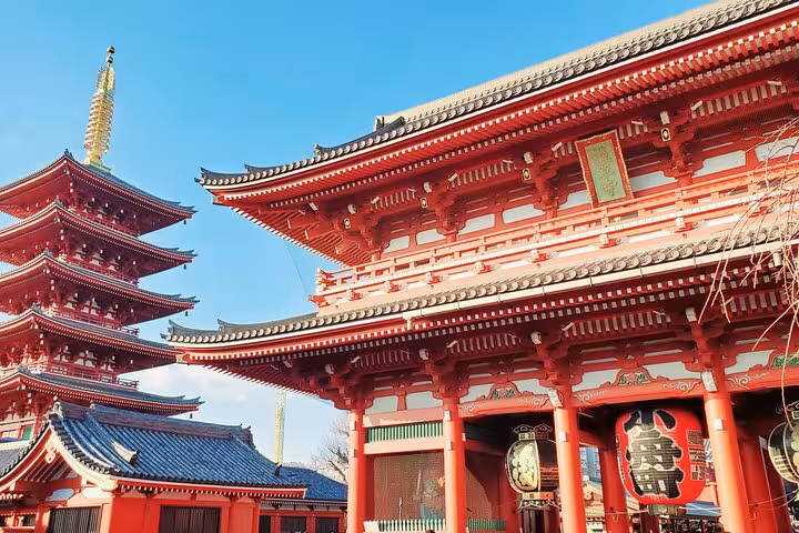 Marvel at the iconic red pagoda of Senso-ji Temple under clear skies on a Tokyo, Mt. Fuji, and Hakone tour.
