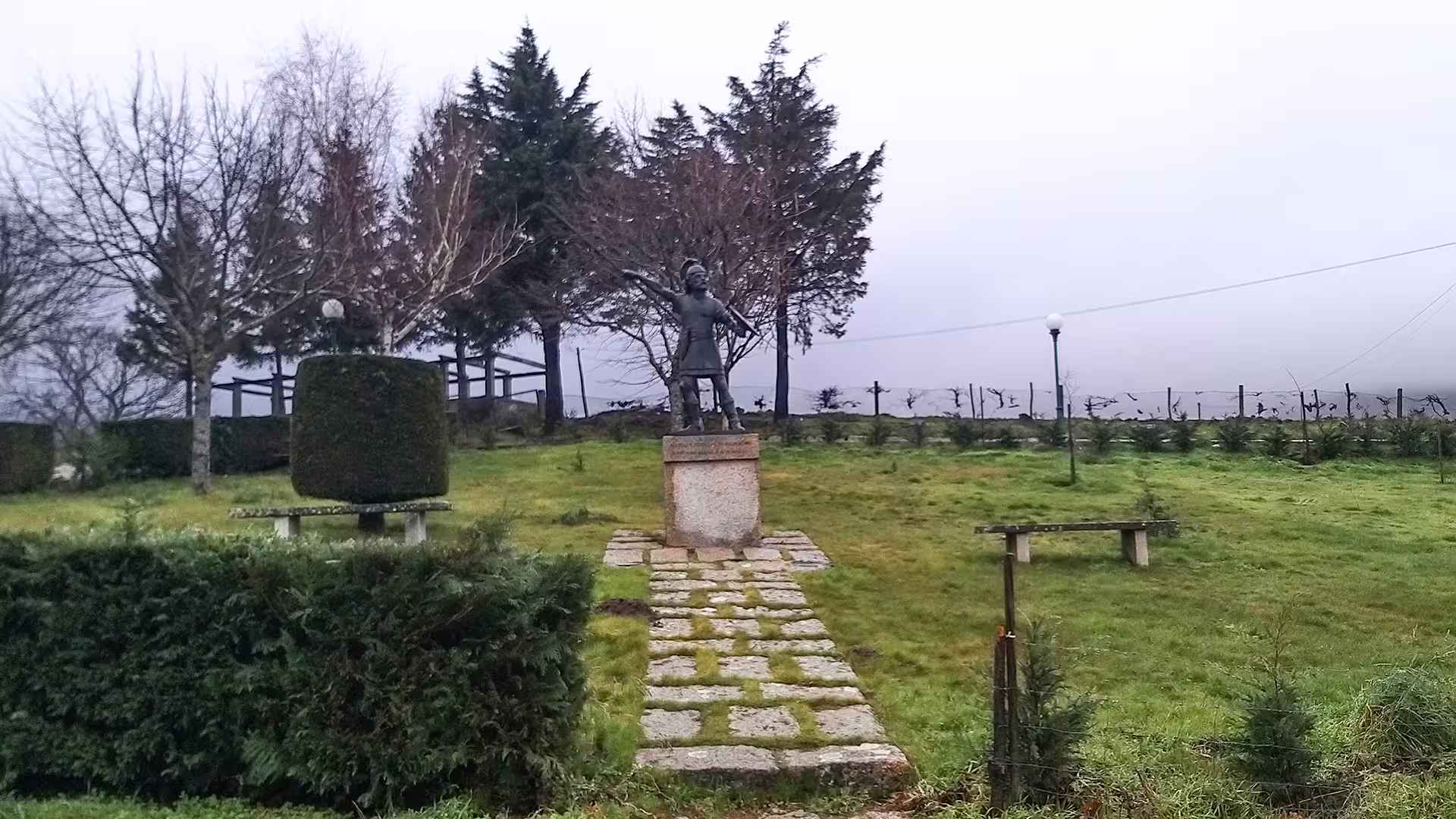 Statue amidst lush greenery in Serra da Estrela Park, showcasing iconic landscapes on a private cheese tasting tour.