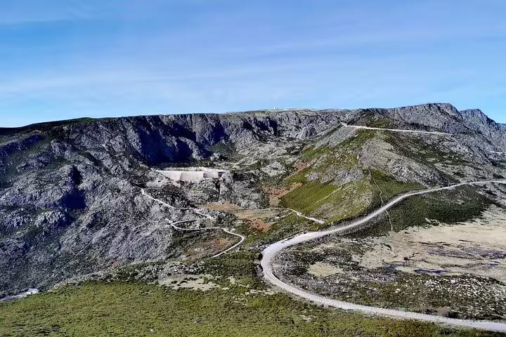 Panoramic view of winding mountain roads through Serra da Estrela, ideal for off-road tours and cheese tasting adventures.