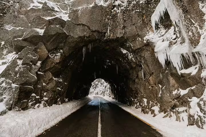 Scenic winter tunnel view in Serra da Estrela, perfect for a private tour from Lisbon through snowy landscapes.