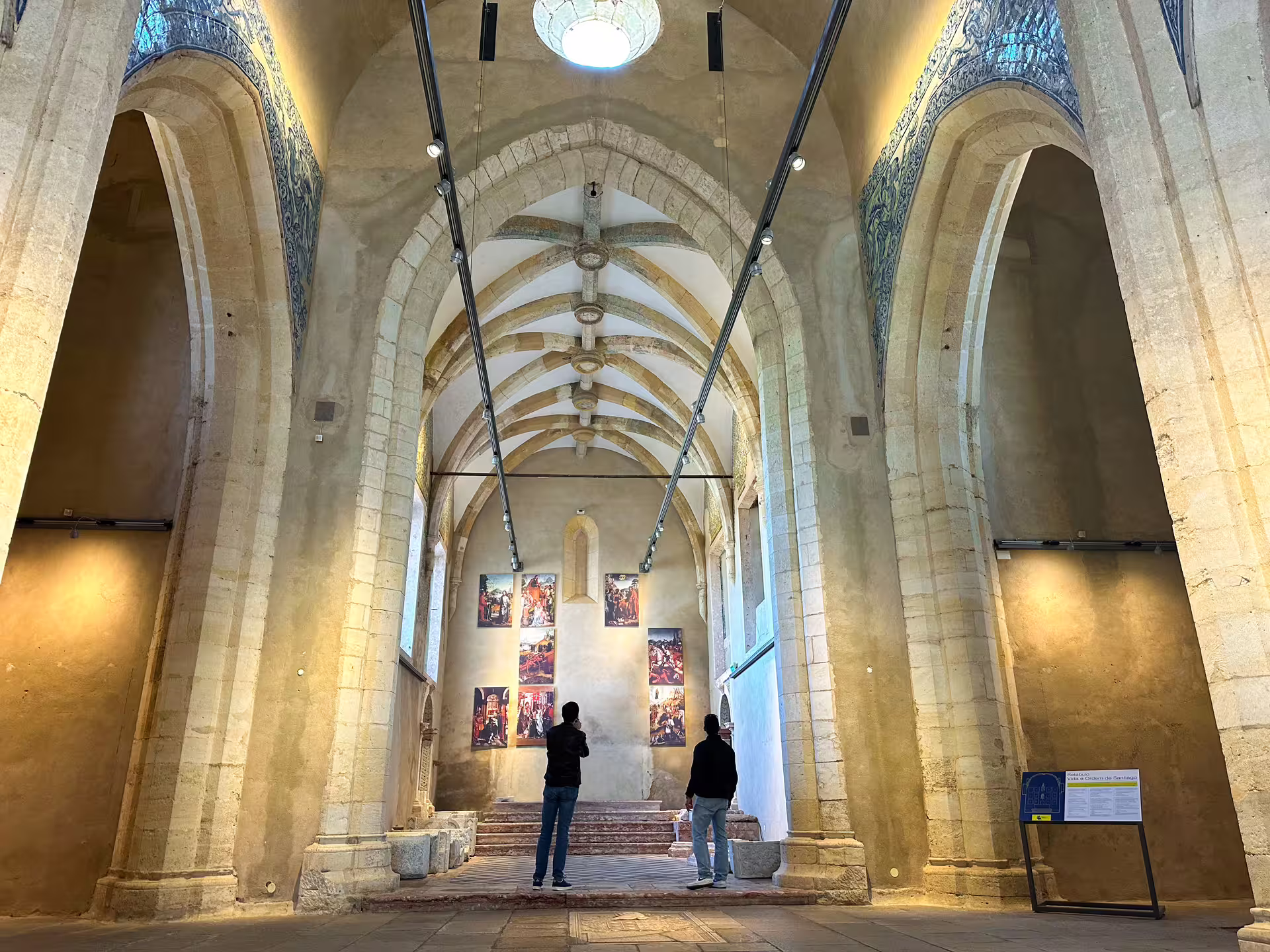 Visitors admire ornate architecture inside a historic building on the Setúbal private van tour.