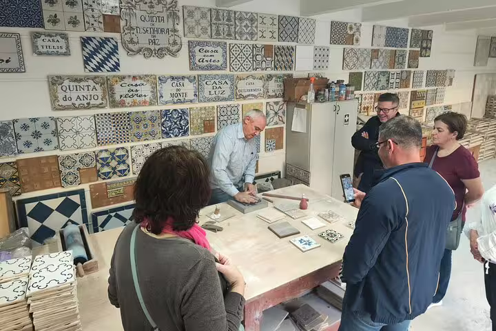 Join a hands-on tile workshop in Setúbal, where visitors learn traditional techniques amid beautiful Portuguese tiles.