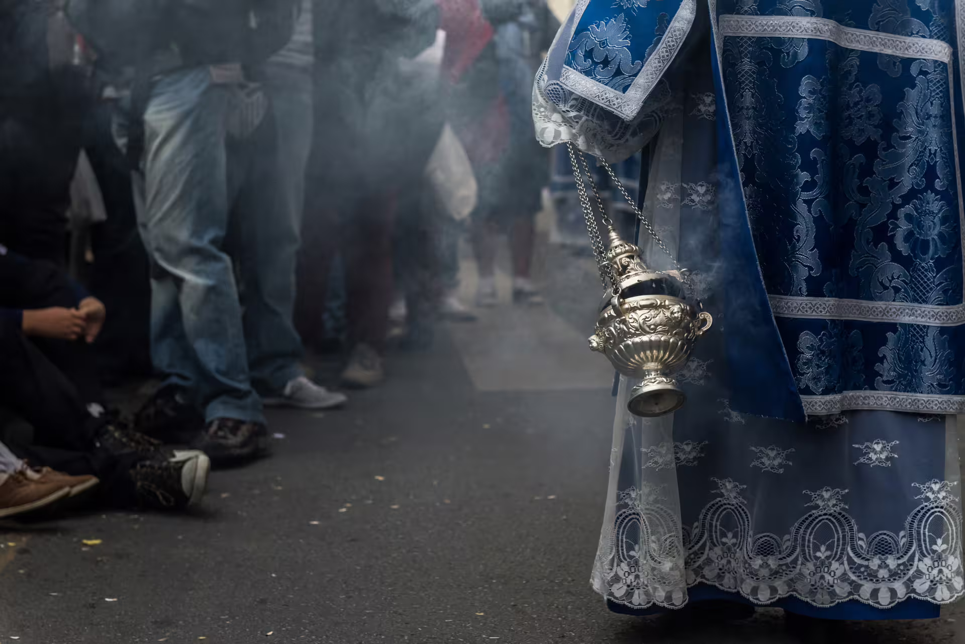 Aromatic incense fills the air during a traditional Seville procession, highlighting the cultural richness of Brotherhood's private tour.