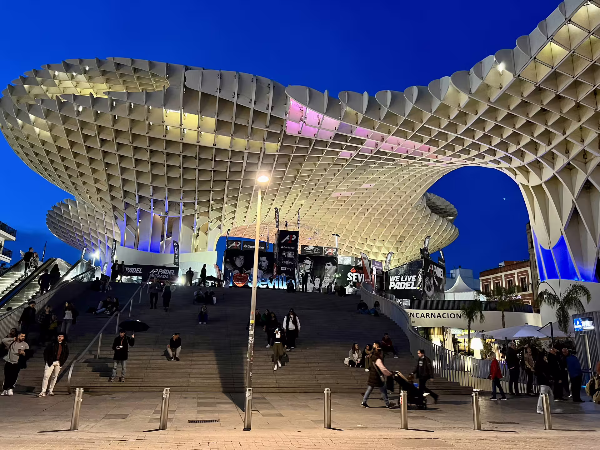 Seville's Metropol Parasol illuminated at night, a key location for the Mysterious and Paranormal Tour, attracting curious visitors.