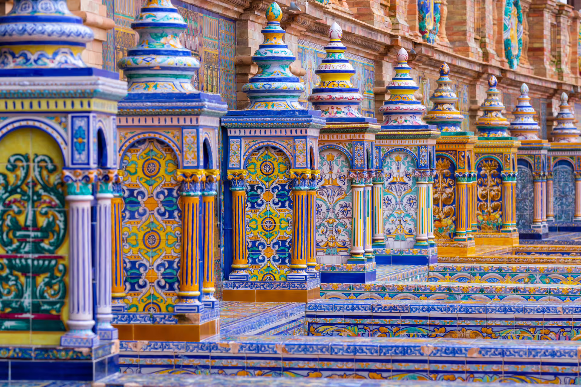 Colorful ceramic bridges and tiles at Plaza de España, Seville walking tour with 7-language audioguide