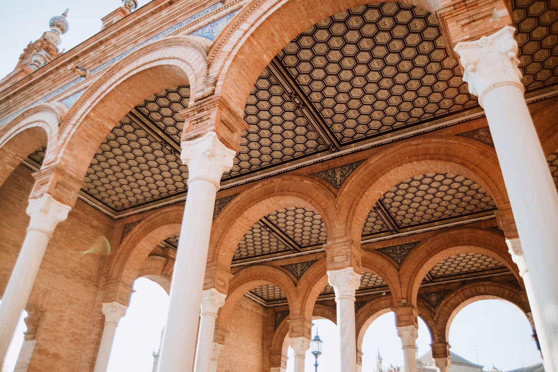 Elegant arches and intricate architecture of Seville's Plaza de España, showcased during a small group walking tour.