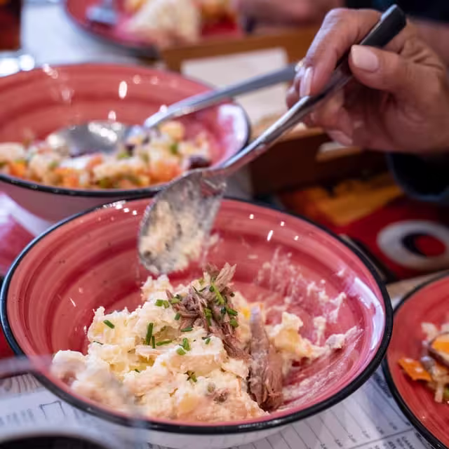 Delicious tapas being served at a vibrant Seville eatery during a historic walking tour.