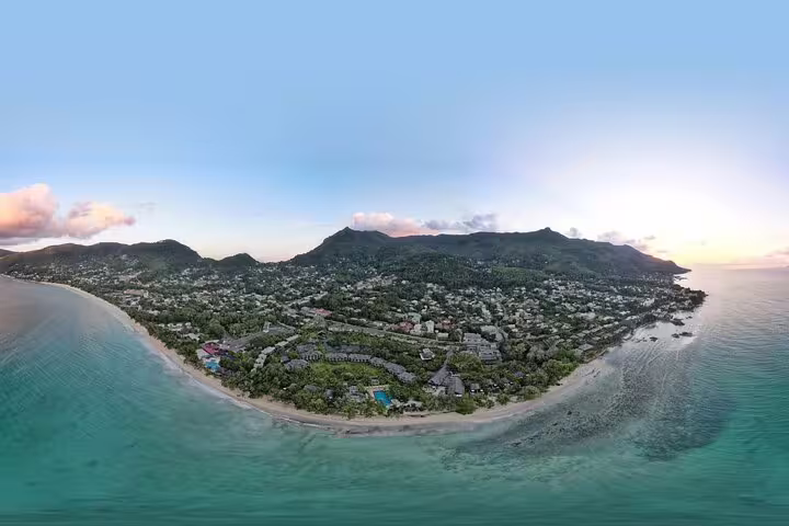 Panoramic view of Seychelles coastline and lush landscape, highlighting the beauty of a private island tour.