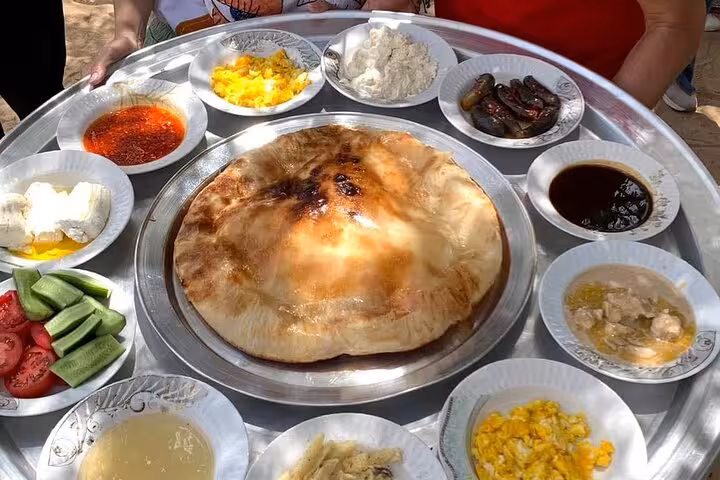 Traditional Egyptian farm lunch spread after Shagie Farms strawberry picking eco-tour from Cairo, bread and sides