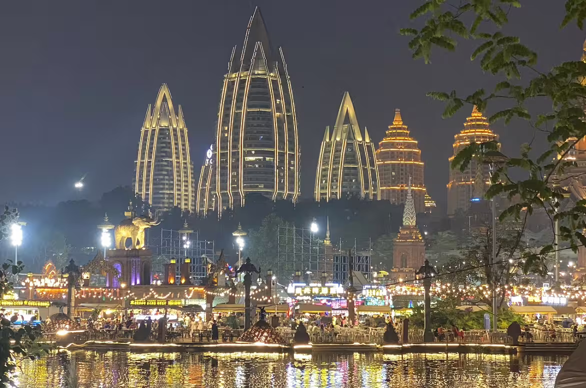 Stunning night view of illuminated modern skyscrapers in Shanghai, capturing the vibrant nightlife on a Shanghai to Laos tour.