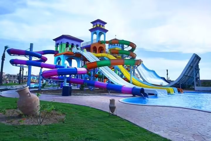 Colorful spiral water slides and splash pool at Sharm El Sheikh aqua park, full-day admission ticket fun
