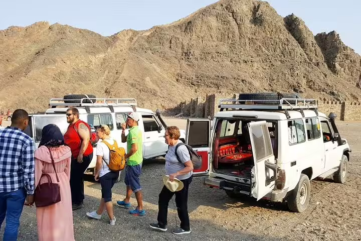 Guests arrive by 4x4 jeeps for a Sharm El Sheikh Bedouin desert safari tour in Sinai mountains