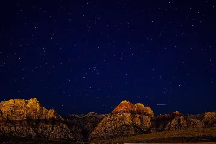 Starry night sky over Sinai desert mountains, stargazing stop on Sharm El Sheikh quad safari with dinner show
