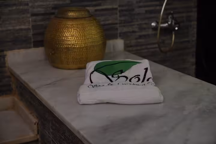 Spa towel and brass basin on marble bench at Sharm El Sheikh Royal Hammam and solo spa experience