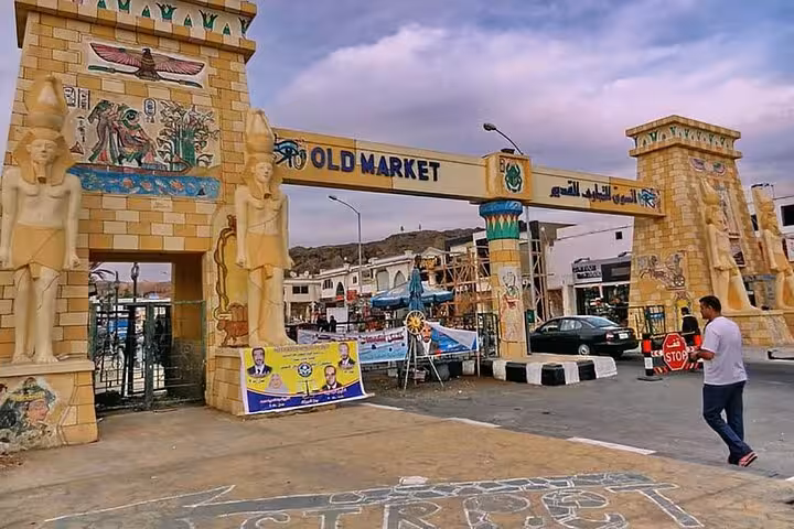 Entrance gate of Sharm El-Sheikh Old Market with Egyptian murals, featured stop on the city tour