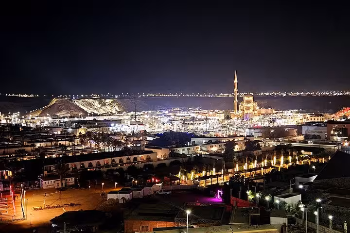 Night skyline of Sharm El-Sheikh Old Market with illuminated mosque, seen on a private museum and bazaar tour
