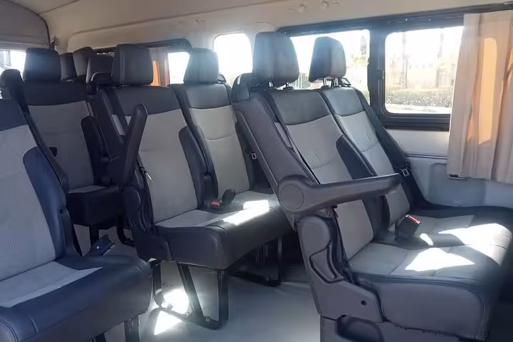 Spacious minibus interior with reclining seats for Sharm El Sheikh private hotel transfer to any destination