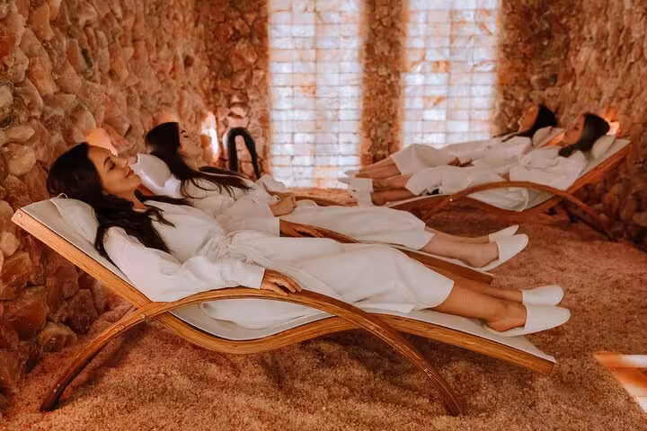 Guests relaxing on loungers inside a Sharm El Sheikh salt cave, part of wellness and local shopping tour