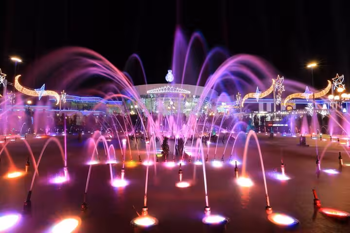 Night fountains at SOHO Square on Sharm El-Sheikh city tour, vibrant lights and water show in Egypt