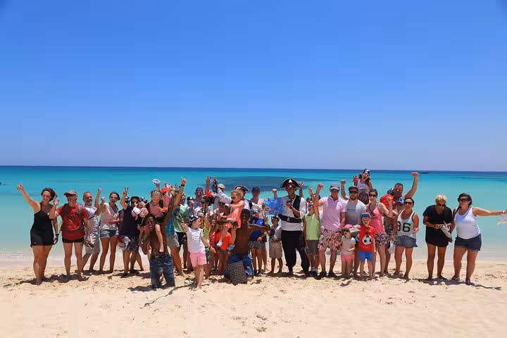 Group photo on White Island sandbar during Sharm El Sheikh pirate boat trip to Ras Mohammed with lunch