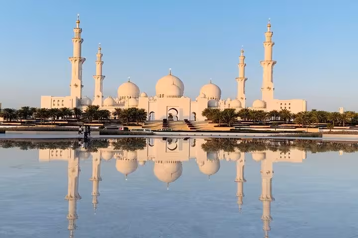 Sheikh Zayed Grand Mosque reflected in water, Abu Dhabi layover sightseeing tour with airport transfers