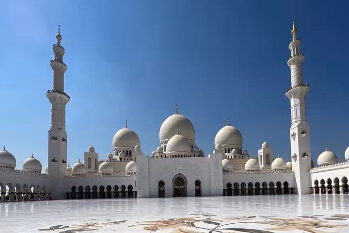 Sheikh Zayed Grand Mosque domes and minarets in Abu Dhabi, a highlight on the city tour with 300M coffee