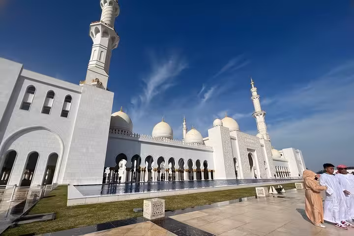 Sheikh Zayed Grand Mosque exterior and domes on Abu Dhabi city tour, ending with coffee at Etihad Tower
