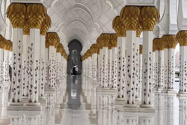 Sheikh Zayed Grand Mosque colonnade with floral columns, Abu Dhabi city tour with Qasr Al Watan entry