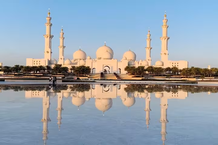 Sheikh Zayed Grand Mosque Abu Dhabi on multi day tour from Dubai, white domes reflected in calm water