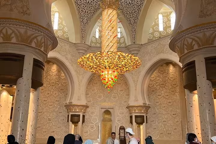 Sheikh Zayed Grand Mosque chandelier and arches on a private Abu Dhabi tour with multilingual guide experience