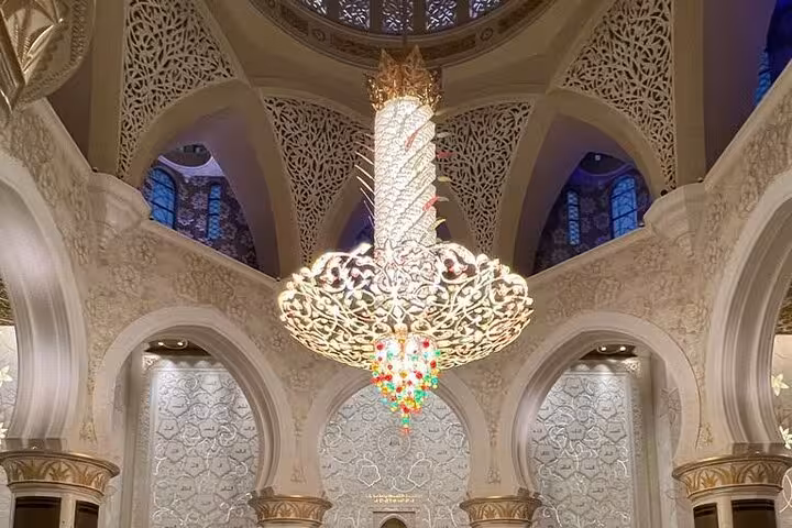 Sheikh Zayed Grand Mosque chandelier and ornate arches seen on a private Abu Dhabi city tour with entrance