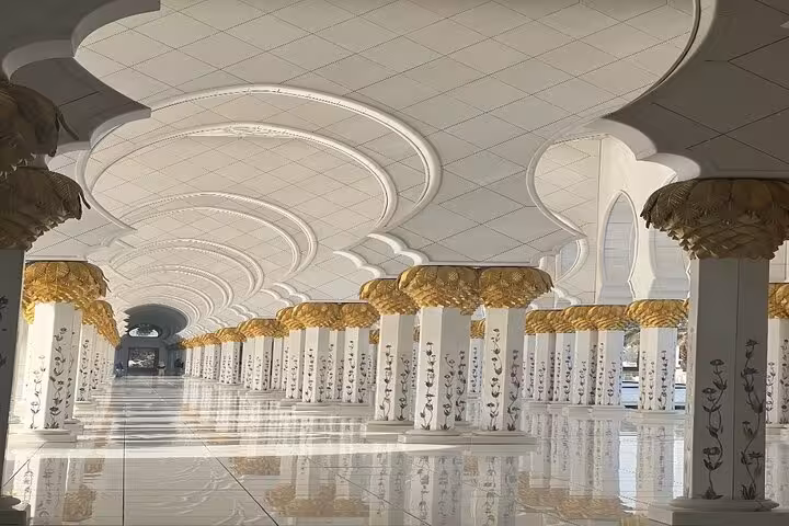 Sheikh Zayed Grand Mosque interior colonnade with floral marble pillars, Abu Dhabi sunset tour option