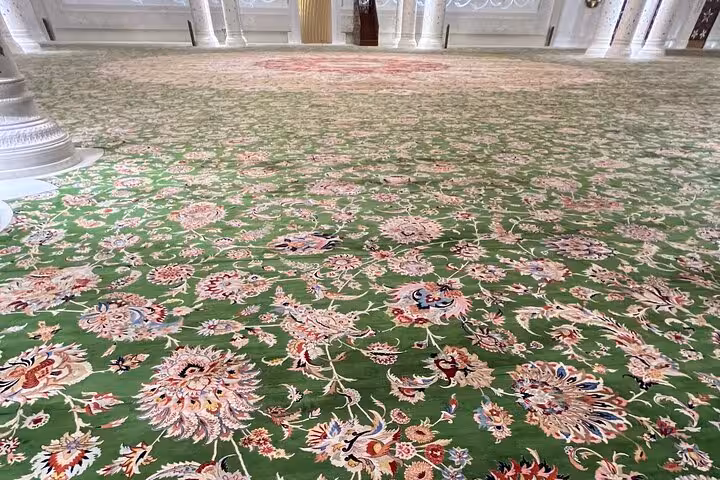 Close-up of Sheikh Zayed Grand Mosque’s hand-knotted floral carpet on Abu Dhabi mosque tour