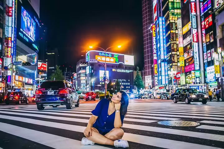 Night photo shoot at Shinjuku crosswalk, Tokyo with personal travel photographer, neon lights and traffic