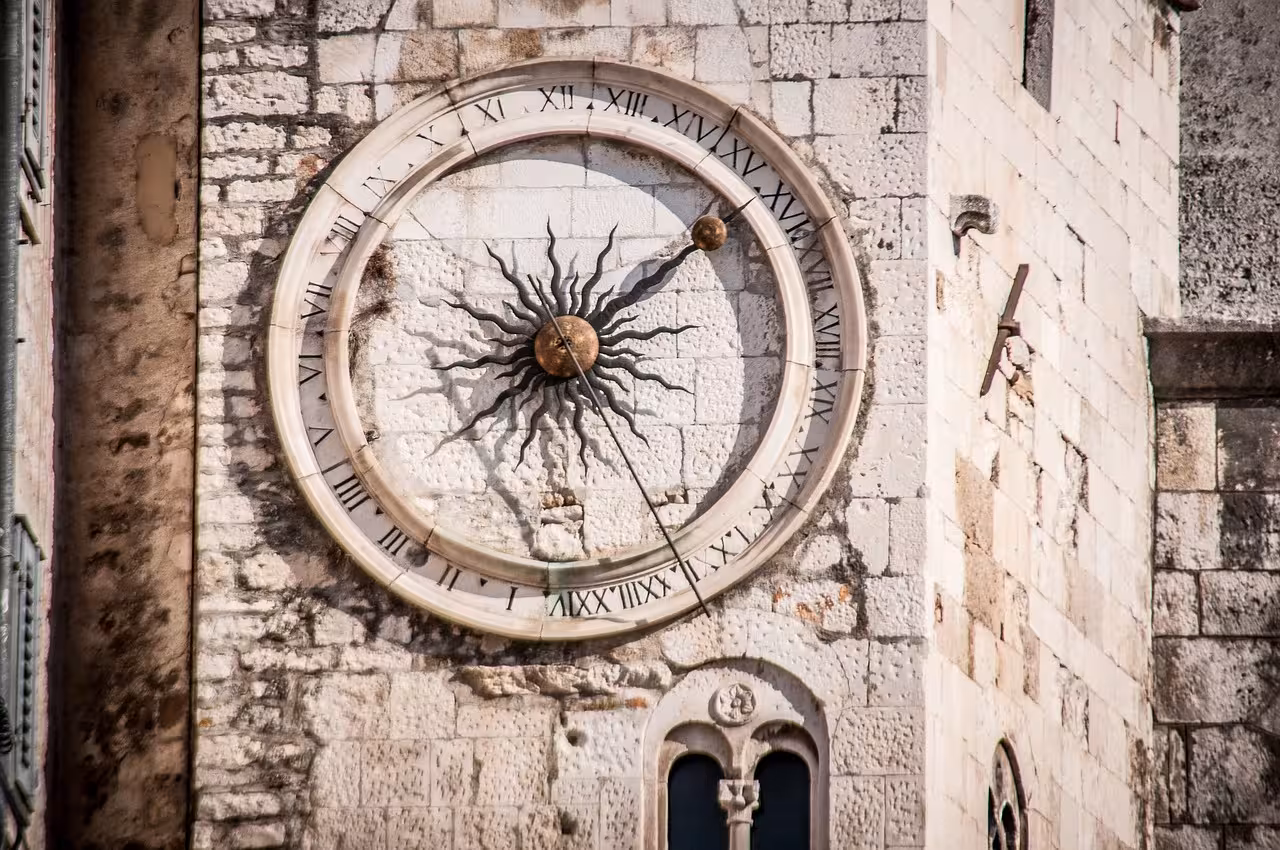 Historic Šibenik old town sun clock on stone wall, cultural detail on Discover Šibenik from Zadar