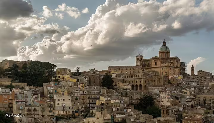 Sicilian historic cityscape with cathedral dome, stop on Palermo group tour to Valley of the Temples