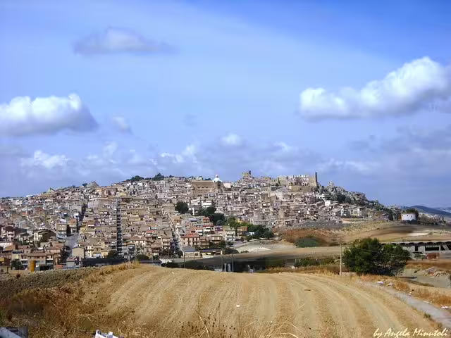 Hilltop Sicilian town panorama en route on Palermo group tour to Valley of the Temples and Villa Romana