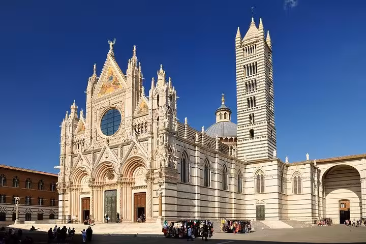The stunning Siena Cathedral with intricate Gothic architecture, a highlight on the Livorno port to Siena excursion tour.