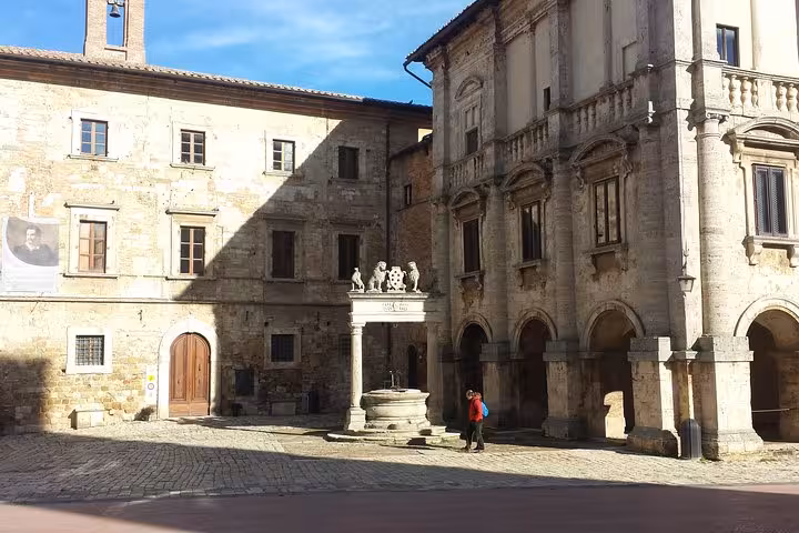 Historic Siena piazza with stone palazzo and fountain, Tuscany day trip from Florence with Montepulciano wines