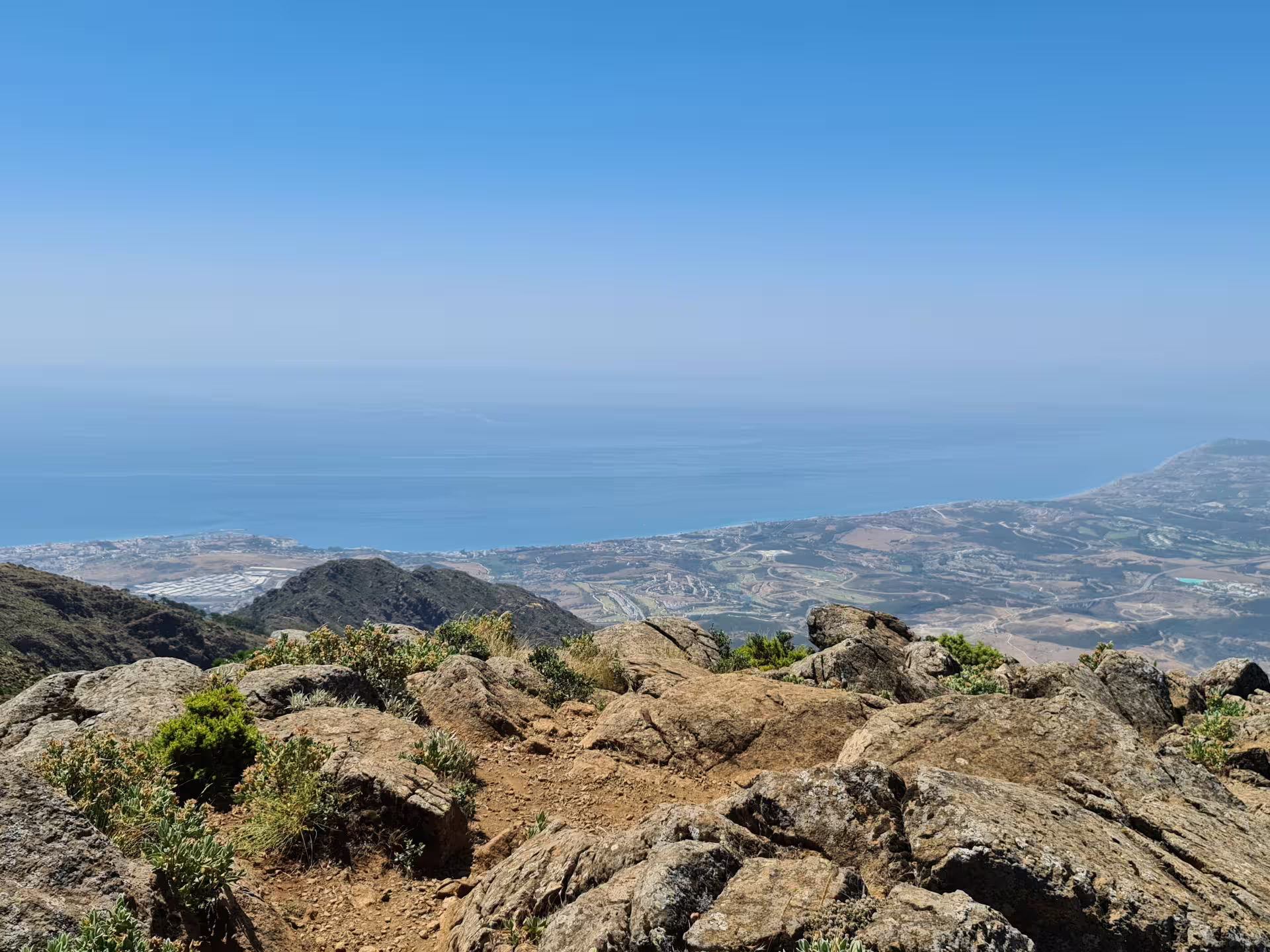 Scenic view from Sierra Bermeja's Bosque de Pinsapos hiking trail overlooking the Mediterranean coast, ideal for private tours.